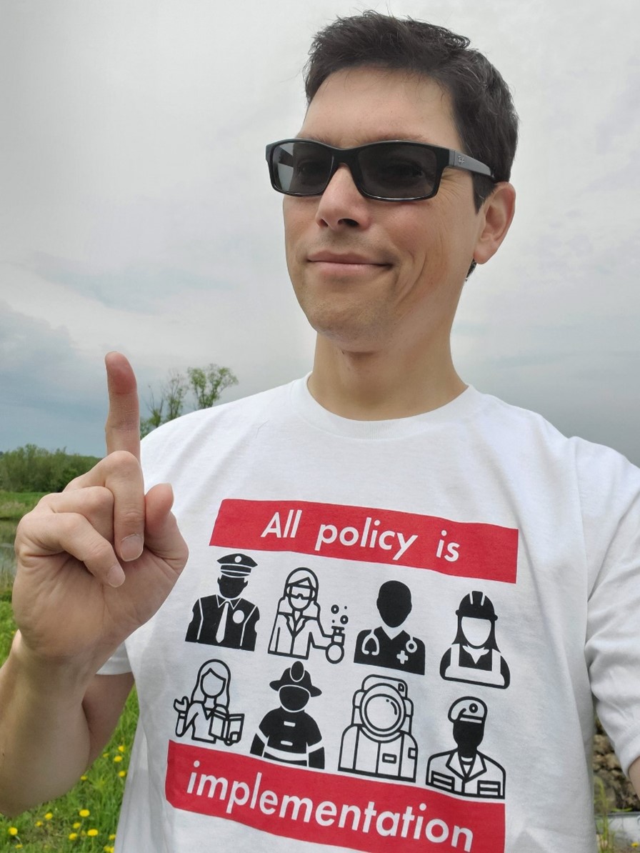 Manny wearing all policy is implementation tshirt